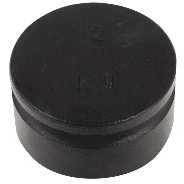 A black plastic round cap with the number 2 on it.