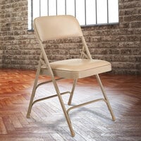 National Public Seating 1301 Beige Metal Folding Chair with 1 1/4 inch French Beige Vinyl Padded Seat