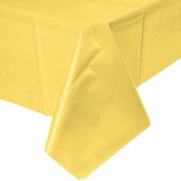 Creative Converting 1252 108 inch x 54 inch Mimosa Yellow Disposable Plastic Table Cover - 12/Case