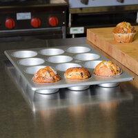 12 Cup 7 oz. Glazed Aluminized Steel Jumbo Muffin / Cupcake Pan - 12 7/8 inch x 17 7/8 inch