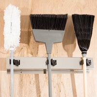 Bobrick B-223 24 inch Stainless Steel Mop / Broom Rack with 3 Holders
