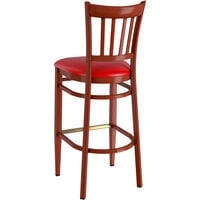 Lancaster Table & Seating Spartan Series Bar Height Metal Slat Back Chair with Mahogany Wood Grain Finish and Red Vinyl Seat - Detached Seat