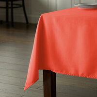 Intedge 54 inch x 120 inch Rectangular Orange 100% Polyester Hemmed Cloth Table Cover