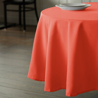 Intedge 90 inch Round Orange 100% Polyester Hemmed Cloth Table Cover