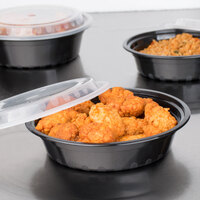 Choice 24 oz. Black 7 1/4 inch Round Microwavable Heavy Weight Container with Lid - 150/Case