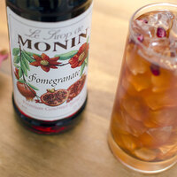 Monin 750 mL Premium Pomegranate Flavoring / Fruit Syrup