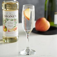 Monin 750 mL Premium White Peach Flavoring / Fruit Syrup