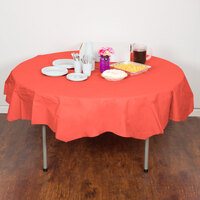 Creative Converting 923146 82 inch Coral Orange OctyRound Tissue / Poly Table Cover
