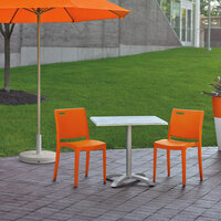 Grosfillex US563019 / US653019 Metro Orange Indoor / Outdoor Stacking Resin Chair - Pack of 4