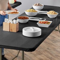 Creative Converting 702000 Stay Put Black 30 inch x 96 inch Rectangular Plastic Tablecloth with Elastic - 12/Case