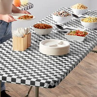 Creative Converting 37397 Stay Put Black Check 30 inch x 96 inch Rectangular Plastic Tablecloth with Elastic