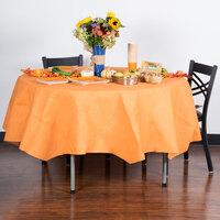 Creative Converting 323402 82 inch Pumpkin Spice Orange OctyRound Tissue / Poly Table Cover
