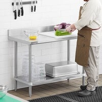 Regency Spec Line 24 inch x 48 inch 14 Gauge Stainless Steel Commercial Work Table with 4 inch Backsplash and Undershelf