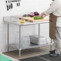Regency Spec Line 30 inch x 48 inch 14 Gauge Stainless Steel Commercial Work Table with 4 inch Backsplash and Undershelf