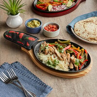 Choice 9 1/4 inch x 7 inch Oval Pre-Seasoned Cast Iron Fajita Skillet with Natural Finish Wood Underliner and Chili Pepper Cotton Handle Cover