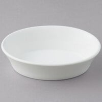 Tuxton BWK-100 10 oz. White Oval China Baker Dish / Bowl - 12/Case