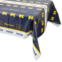 Creative Converting 331399 54 inch x 108 inch University of Michigan Plastic Table Cover - 12/Case