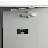 Vollrath 4525 Traex® Restrooms For Customer Use Only Sign - Black and White, 9 inch x 3 inch