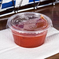 Fabri-Kal GXL250PC Greenware 2 oz. Compostable Clear Plastic Souffle / Portion Cup Lid - 2000/Case