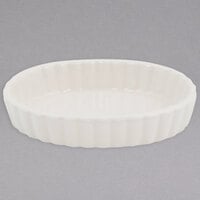 Tuxton BEK-0506 5 oz. Eggshell Oval Fluted China Souffle / Creme Brulee Dish - 24/Case