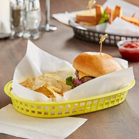 Tablecraft 1076Y 10 5/8 inch x 7 inch x 1 1/2 inch Yellow Oval Chicago Platter Basket - 12/Pack