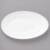 Bon Chef 1100007P Slanted Oval 9 1/2 inch x 5 5/8 inch White Porcelain Plate - 24/Case
