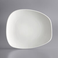 Acopa Nova 10 1/2" x 9 1/4" Cream White Asymmetric Stoneware Plate - 12/Case