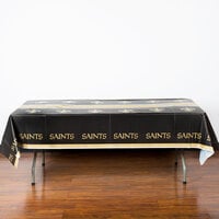 Creative Converting 335928 New Orleans Saints 54 inch x 102 inch Plastic Table Cover - 12/Case