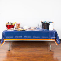 Creative Converting 729510 Denver Broncos 54 inch x 102 inch Plastic Table Cover - 12/Case