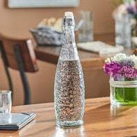 Acopa 32 oz. Textured Glass Water Bottle with Clear Swing Top Lid - 6/Case