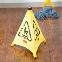Rubbermaid FG9S0000YEL 20 inch Yellow Multi-Lingual Caution Wet Floor Sign Pop-Up Safety Cone