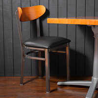 Lancaster Table & Seating Boomerang Clear Coat Finish Chair with 2 1/2 inch Black Vinyl Padded Seat and Cherry Wood Back