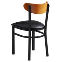 Lancaster Table & Seating Boomerang Black Finish Chair with 2 1/2 inch Black Vinyl Padded Seat and Cherry Wood Back