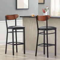 Lancaster Table & Seating Boomerang Black Finish Bar Stool with 2 1/2 inch Black Vinyl Padded Seat and Antique Walnut Wood Back