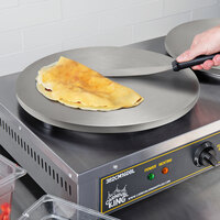 Single crepe maker with folded crepe cooking on its cooktop