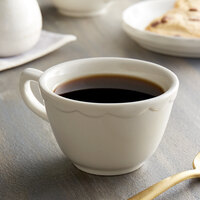 Choice 7 oz. Ivory (American White) Scalloped Edge Stoneware Coffee Cup / Mug - 36/Case