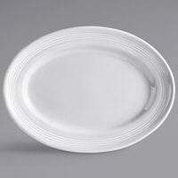 Tuxton CWH-116 Concentrix 11 1/2 inch x 8 3/8 inch White Oval China Platter - 12/Case