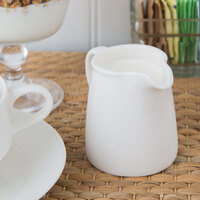 Oneida L6050000802 Zen 4 oz. Warm White Porcelain Creamer - 48/Case