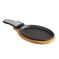 Choice 9 1/4 inch x 7 inch Oval Pre-Seasoned Cast Iron Fajita Skillet with Natural Finish Wood Underliner and Grey Silicone Coated Handle Cover