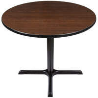 Lancaster Table & Seating Standard Height Table with 36" Round Reversible Walnut / Oak Table Top and Cross Cast Iron Base Plate