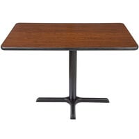 Lancaster Table & Seating Standard Height Table with 24" x 42" Reversible Walnut / Oak Table Top and Cross Cast Iron Base Plate