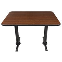 Lancaster Table & Seating Standard Height Table with 30" x 42" Reversible Walnut / Oak Table Top and Straight Cast Iron Table Base Plates