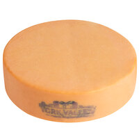 York Valley Cheese Company Druck's 22 lb. Daisy Clear Wax Sharp Colored Cheddar Cheese Flat Wheel