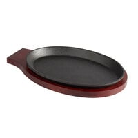 Choice 9 1/4" x 7" Oval Pre-Seasoned Cast Iron Fajita Skillet with Mahogany Finish Wood Underliner