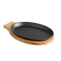 Choice 9 1/4 inch x 7 inch Oval Pre-Seasoned Cast Iron Fajita Skillet with Natural Finish Wood Underliner