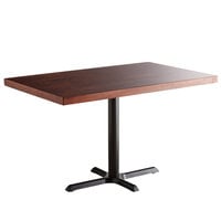 Lancaster Table & Seating 30" x 48" Standard Height Wood Butcher Block Table with Mahogany Finish and Cast Iron Cross Base Plate