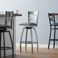 Lancaster Table & Seating Clear Coat Finish Cross Back Swivel Bar Stool with 2 1/2 inch Navy Vinyl Padded Seat