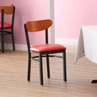 Lancaster Table & Seating Boomerang Black Finish Chair with 2 1/2 inch Red Vinyl Padded Seat and Cherry Wood Back