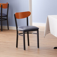Lancaster Table & Seating Boomerang Black Finish Chair with 2 1/2 inch Navy Vinyl Padded Seat and Cherry Wood Back
