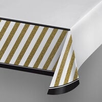 Creative Converting 318098 54" x 102" Black and Gold Plastic Tablecloth - 6/Case